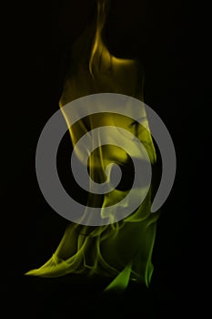 Abstract green and yellow fire smoke on black background, fire design - photo image