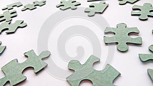 Abstract grey jigsaw puzzle pieces on white background