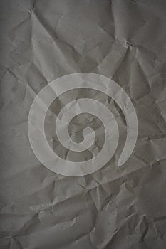 Abstract grey paper wrinkled or crumpled texture background close-up top view, grey texture, rumpled grey paper