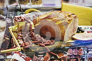 Abstract grocery showcase, assortment of sausages and farm meat products. Selective soft focus