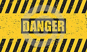 Abstract grunge black danger sign on a yellow background