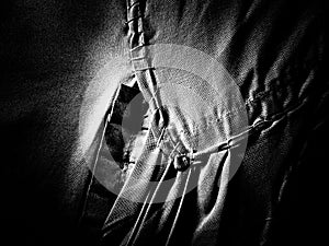 Abstract grunge dirty cloth stitching background. Black and white, so contrast and grainy