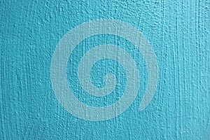 Abstract grunge light blue cyan painted stucco wall texture background with copy space