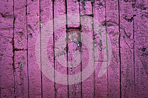 Abstract grunge texture of old pink and violet wall details. Creative background. Rough, weathered stone bricks texture