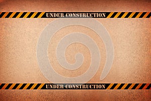 Abstract grunge under construction sign against a