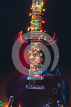 Abstract guitar with festive Christmas lights