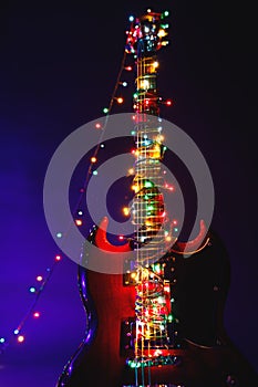 Abstract guitar with festive Christmas lights