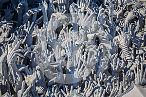 Abstract hands statue from Hell in Wat Rong Khun at Chiang Rai o