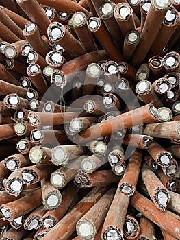 abstract heap of aluminium cables removed from the ground to be recycled