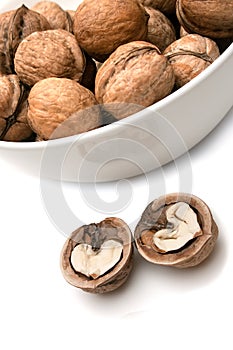 Abstract hearts in walnuts on white background