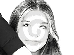 Abstract high soft contrast portrait B&W teenage girl face with eyes highlighted