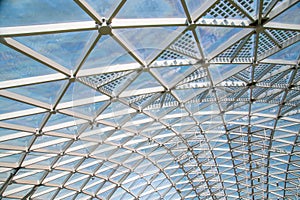 Abstract high-tech architecture background photo, internal structure of glass roof arch with lockable windows sections