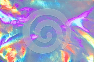 Abstract holographic purple pink background. Liquid neon rainbow foil in unicorn style. Marble iridescent futuristic