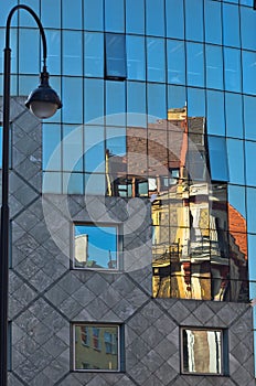 Abstract image as a reflection of old style buildings in a glass of Haas house at downtown of Vienna