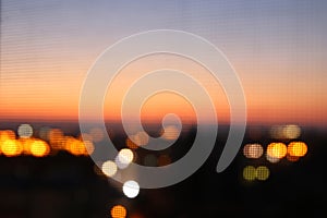 abstract image of blurred night city background with circle lights.