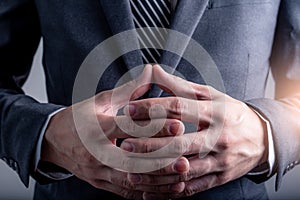 The abstract image of the businessman coordinate the both of hand together.