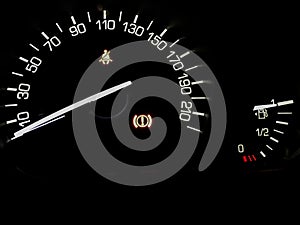 Abstract image of car dashboard with speedometer and fuel tank i