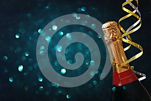 Abstract image of champagne bottle and festive lights