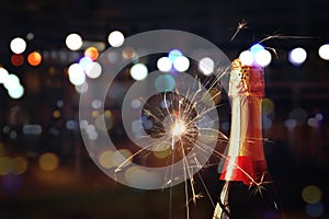 Abstract image of champagne bottle and festive lights