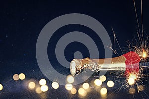 Abstract image of champagne bottle and festive lights