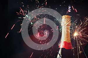 Abstract image of champagne bottle and festive lights