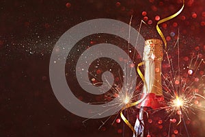 Abstract image of champagne bottle and festive lights