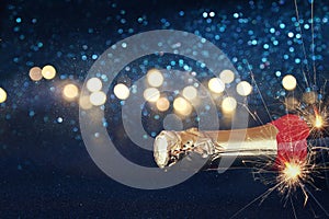 Abstract image of champagne bottle and festive lights