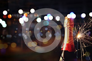 Abstract image of champagne bottle and festive lights