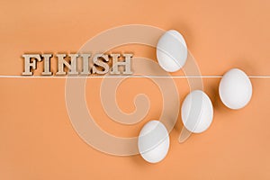 Abstract image. Egg behind the a finish line