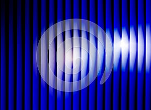 Abstract vertical blue lines background with glowing white light effect