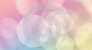 Abstract image featuring a soft bokeh effect with large overlapping circles. The