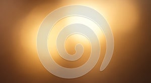 Abstract image featuring a warm, golden bokeh effect with diffused light sources creating a soft,