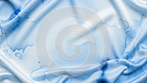Abstract image with a flowing fabric-like texture in soft blue and white
