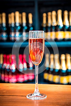 Abstract image of a glass with champagne on the background of bo