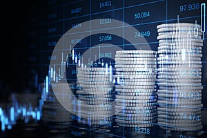 Abstract image of growing coin stacks and candlestick forex chart on blurry background. Trade, money and financial growth concept