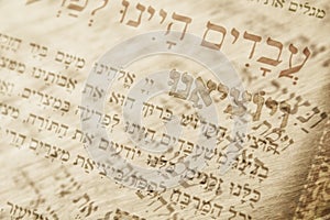 Abstract image of Judaism concept with closeup text in hebrew from the passover haggadah photo