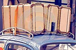 Abstract image with large suitcases on the roof of a retro car. journey, vacation - concept