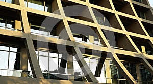 Abstract image of looking up at modern glass and concrete building. Architectural exterior detail of office building