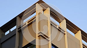 Abstract image of looking up at modern glass and concrete building. Architectural exterior detail of office building