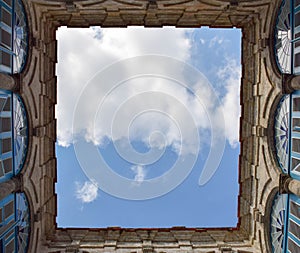 Abstract image of looking up through an old square building in havanna, cuba