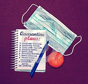 An abstract image of a medical mask and a notebook with plans for what to do while a coronavirus quarantin