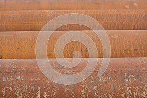 Abstract image of metal pipes showing light on the other end. Background texture.