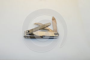 Abstract image of a nail cutter on white background. Nail clipper tool. Selective focus