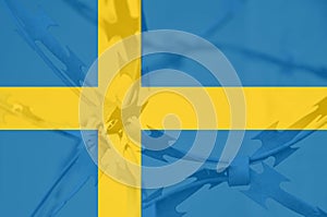 Abstract image of the national flag of Sweden with twisted barbed wire.