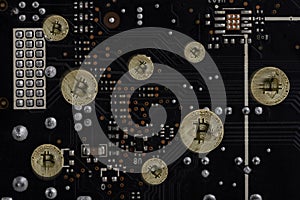 Abstract image Obverse of crypto currency bitcoin on the background of computer`s electronic circuit board.