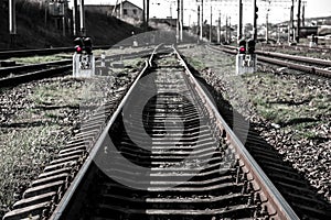 Abstract image with red semaphore lights on both sides of a railway track