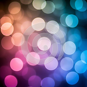 An abstract image showcasing a bokeh effect with circular light patterns. The circles