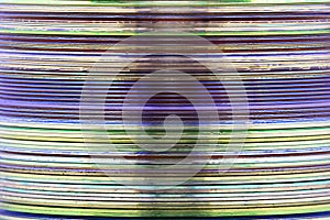 Abstract image of a stack of DVD and CD media taken from a sideways view