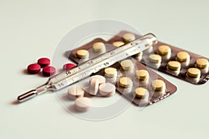 Abstract image of a thermometer with high temperature and medication Ð¡ovid - concept