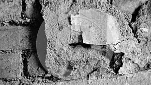 Abstract image of an very old wall, broken plaster with old, partly broken bricks inside, aged with long time